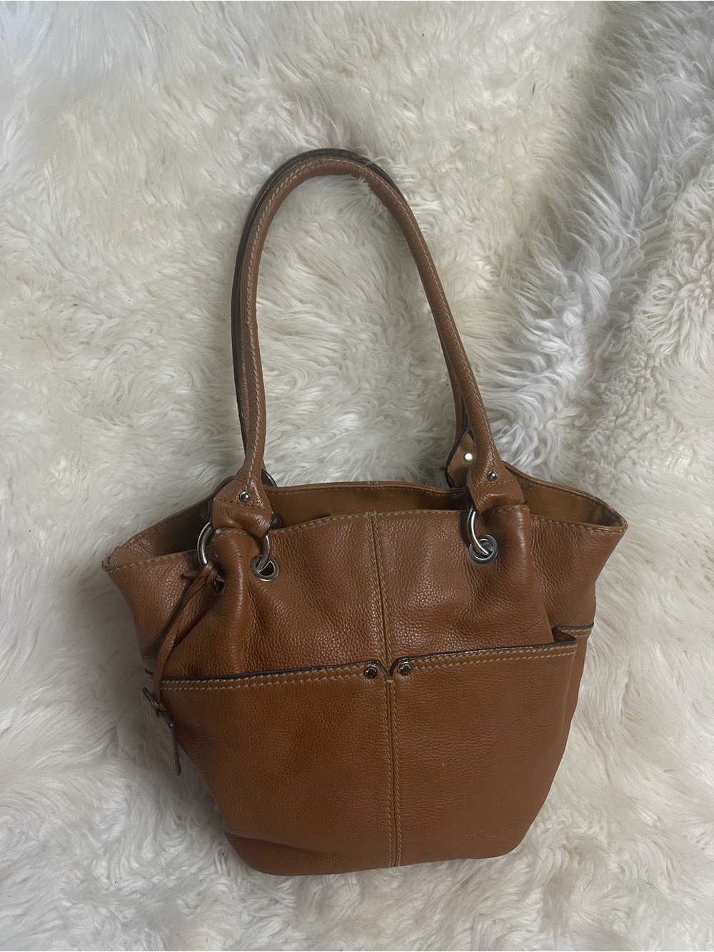 Tignanello Tan Italian leather Bucket bag Features dual shoulder straps.